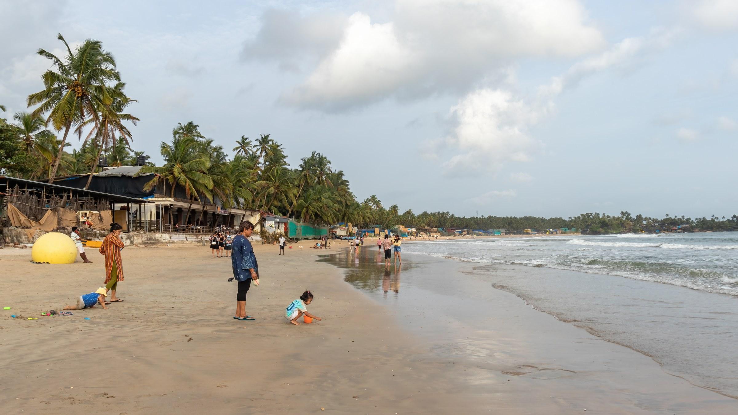 Crescent-shaped bay and shoreline of Palolem Beach, South Goa