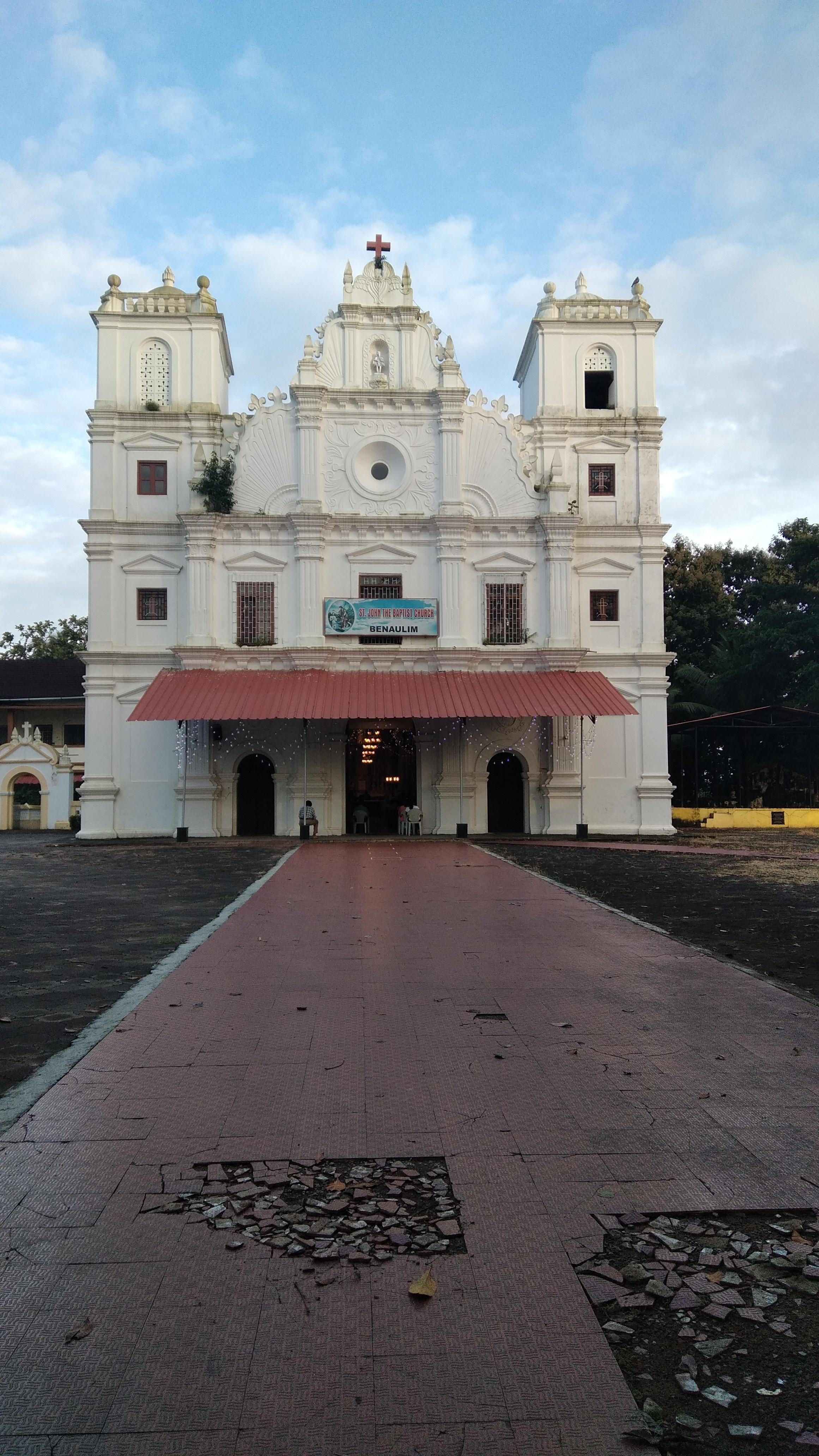Front facade of St. John the Baptist Church at the centre of Benaulim village, Goa